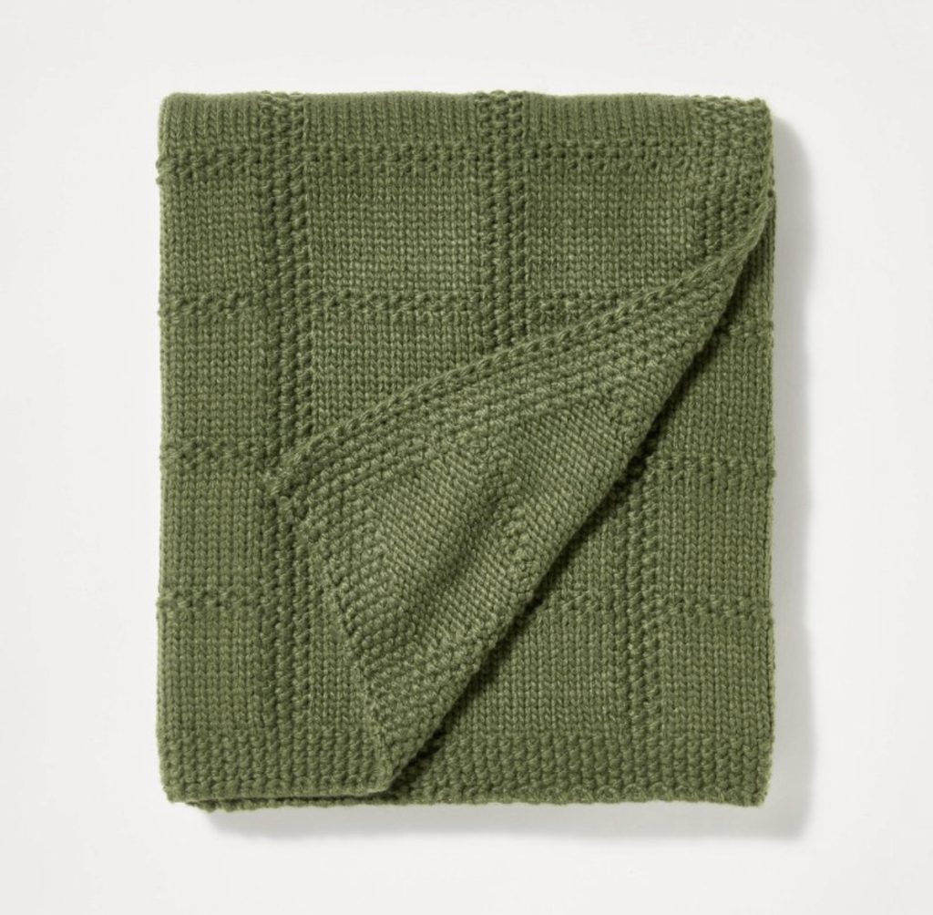 Green knit blanket for a couch or bed during the summer or fall months.