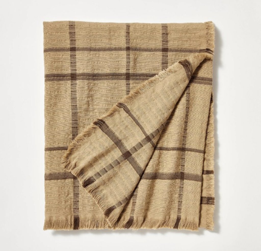 Tan and brown plaid throw blanket for a cozy couch.
