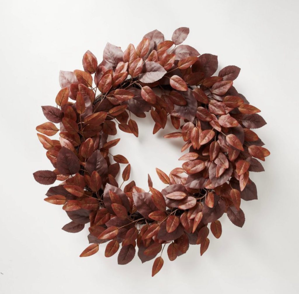 Faux burgundy leaves on a fall wreath for the front door.
