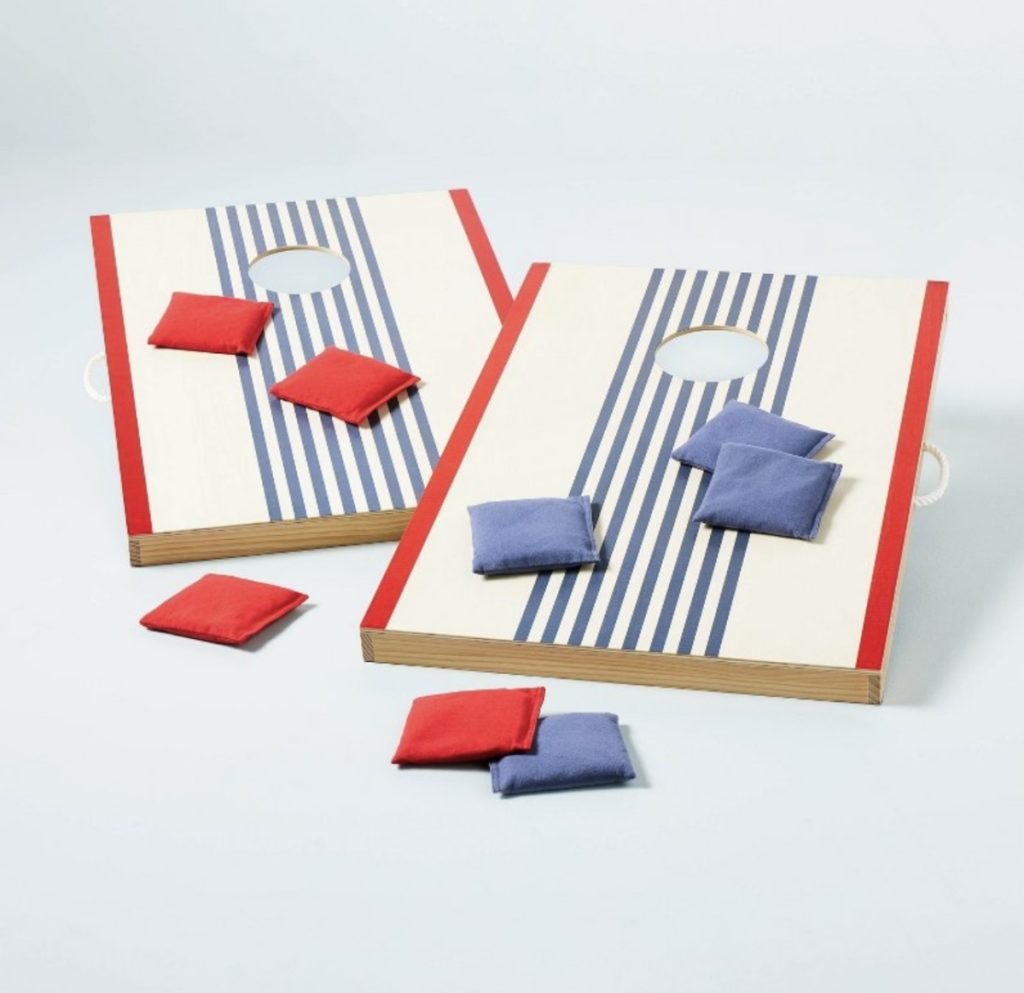 Cornhole game for Father's Day with wooden boards and bean bags.