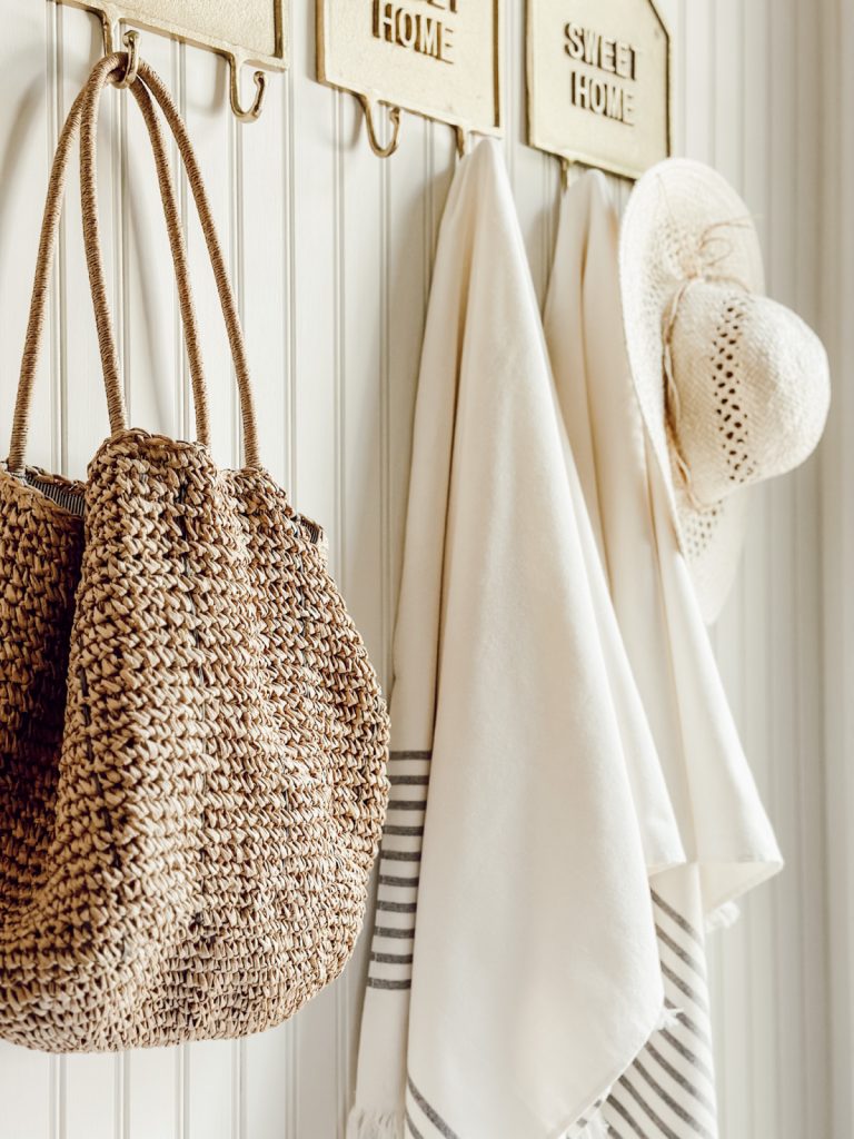 Add pieces you use in the summer to your door for functional decor.
