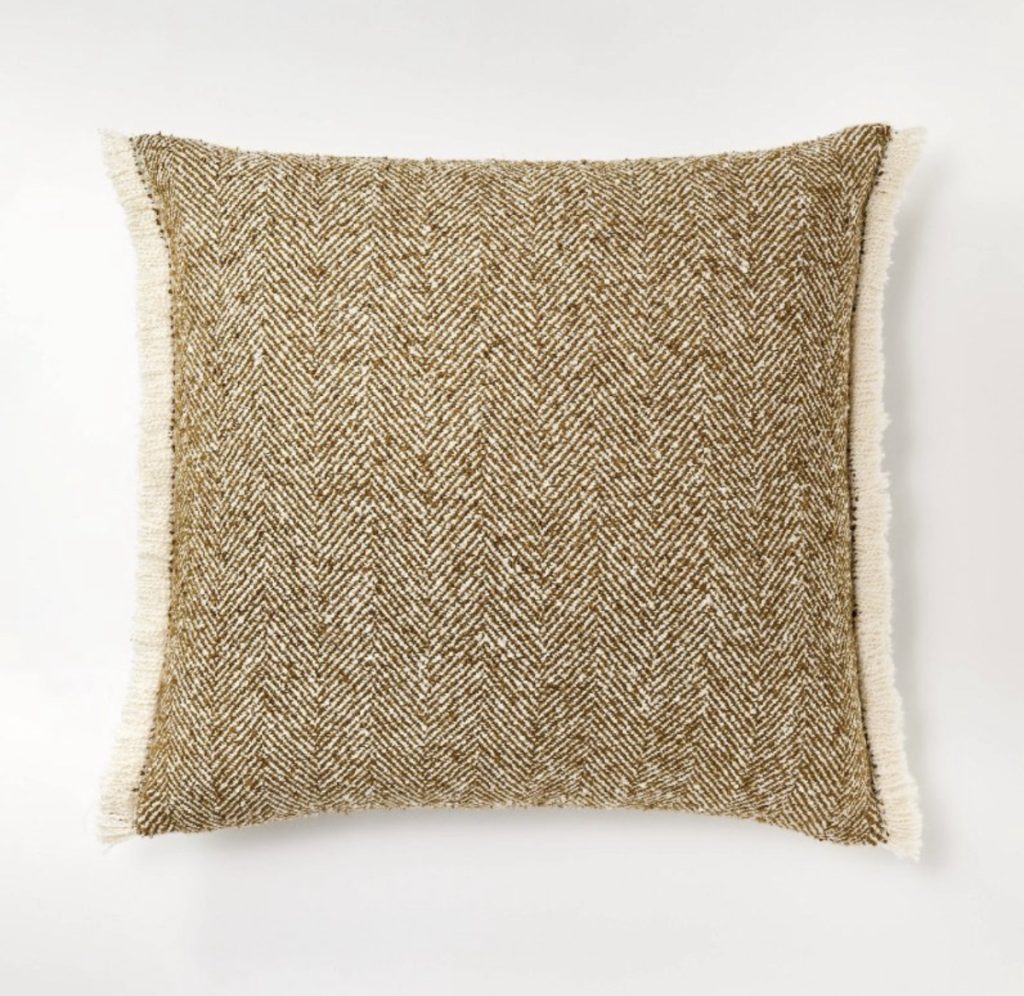 Herringbone wool throw pillow with cream fringe for the couch.