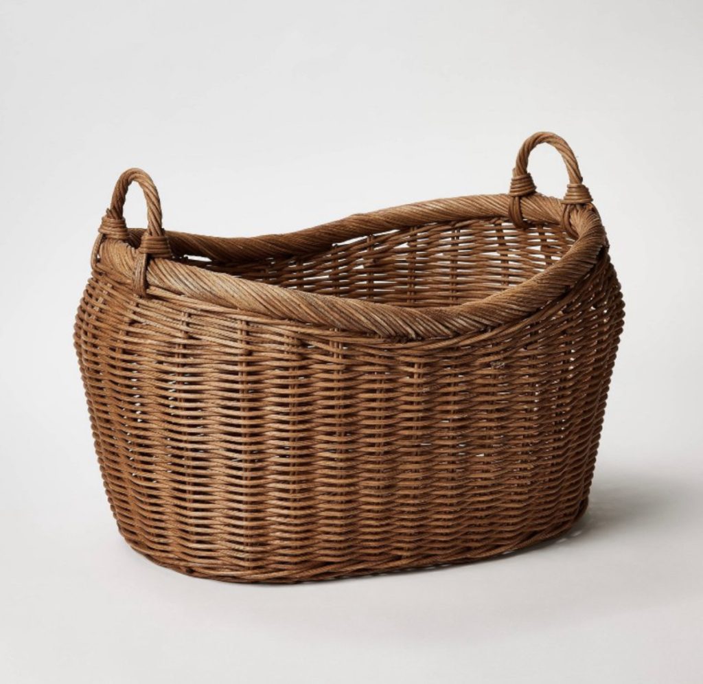 Vintage inspired storage basket for pillows or blankets.