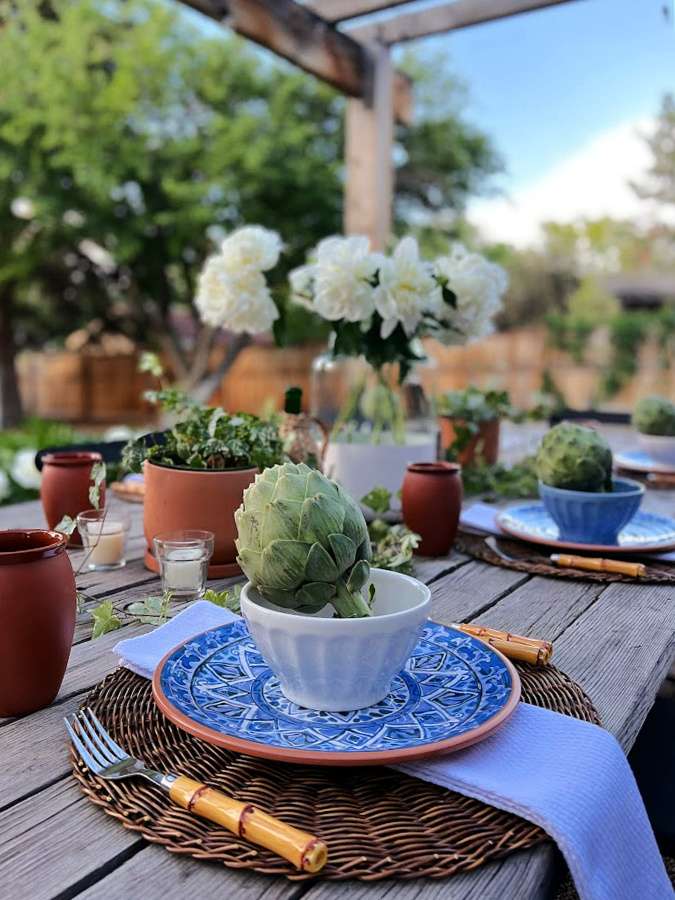 An outdoor tablescape is a fun summer DIY with blues and terracotta.