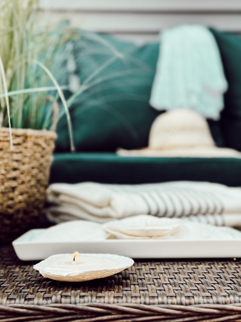 Coastal inspired decor with DIY seashell candles. 