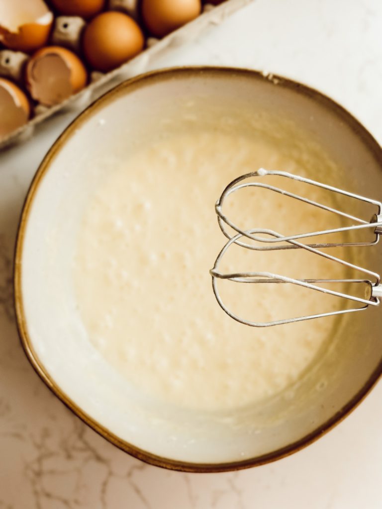 Custard mixture for warm bread pudding dessert.