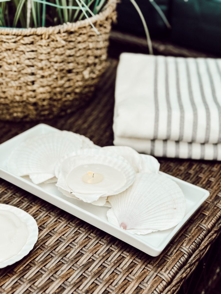 DIY seashell candles for coastal summer decor. 