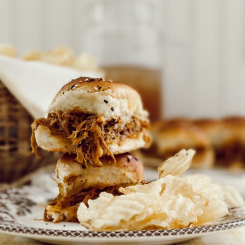 Easy pulled pork slider recipe with Hawaiian rolls and BBQ sauce.