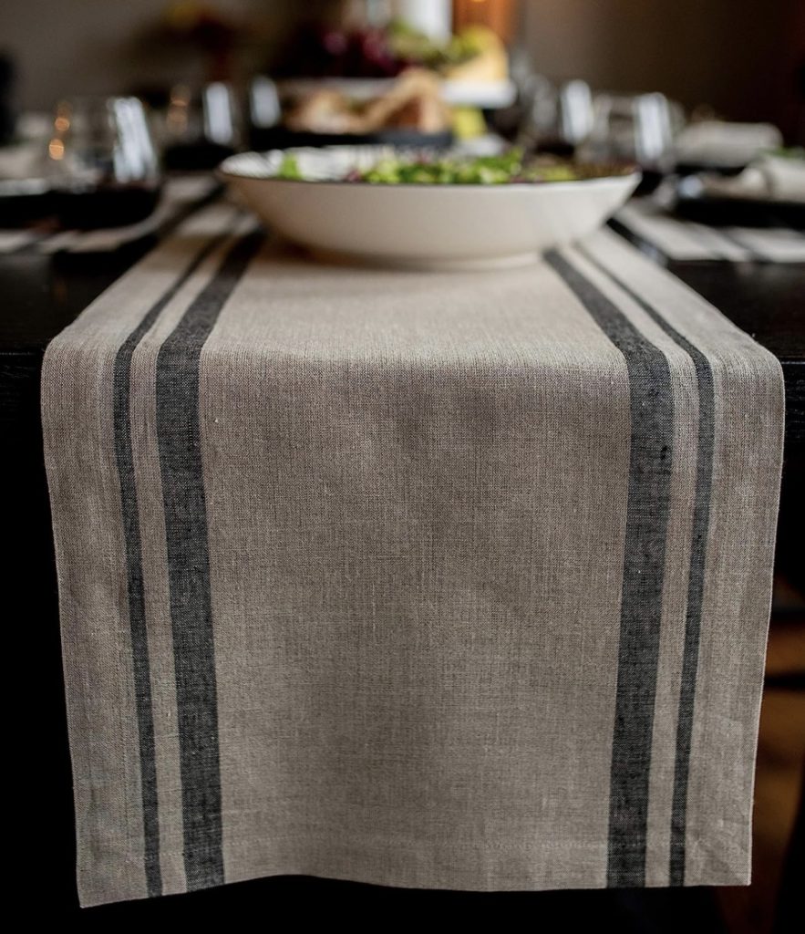Linen green stripe table runner for a dining room or kitchen table.