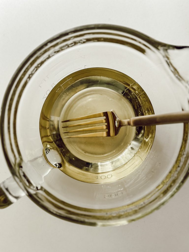 Melted soy candle wax for DIY candles in shells.
