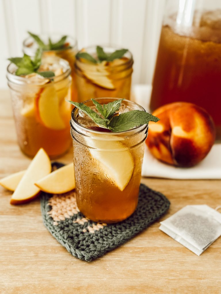 Sweet peach iced tea for summer with fresh peaches and Earl Grey tea.