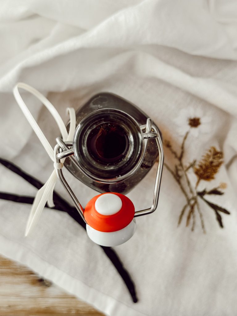 Bourbon extract made at home with bourbon liquor and Madagascar vanilla beans.