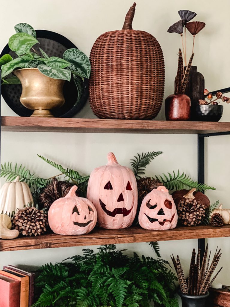 Terracotta pumpkins made to look like the Pottery Barn ones.