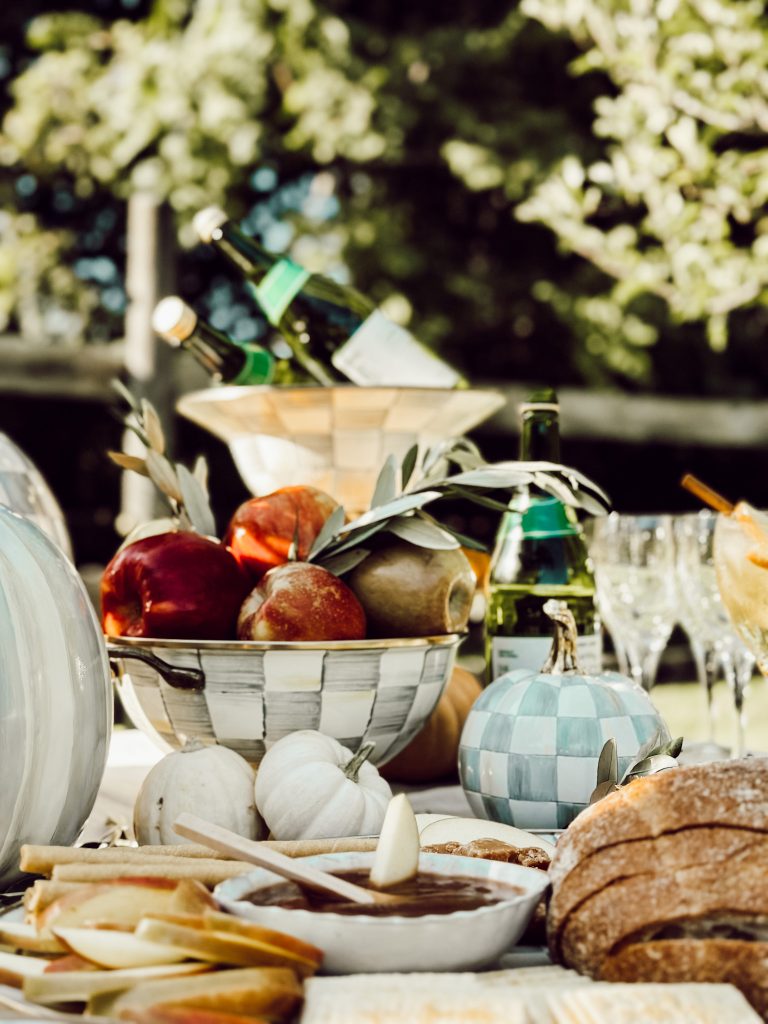 Backyard outdoor table setting with MacKenzie-Childs products.
