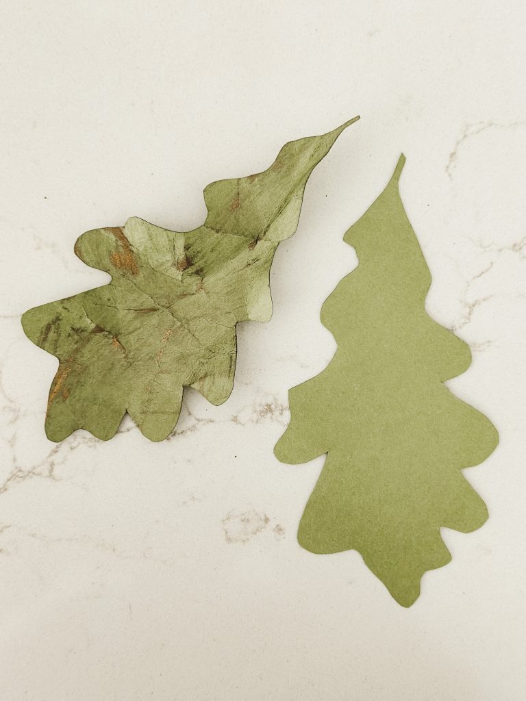 DIY fall decor with paper oak leaves for a autumn garland with acorns.