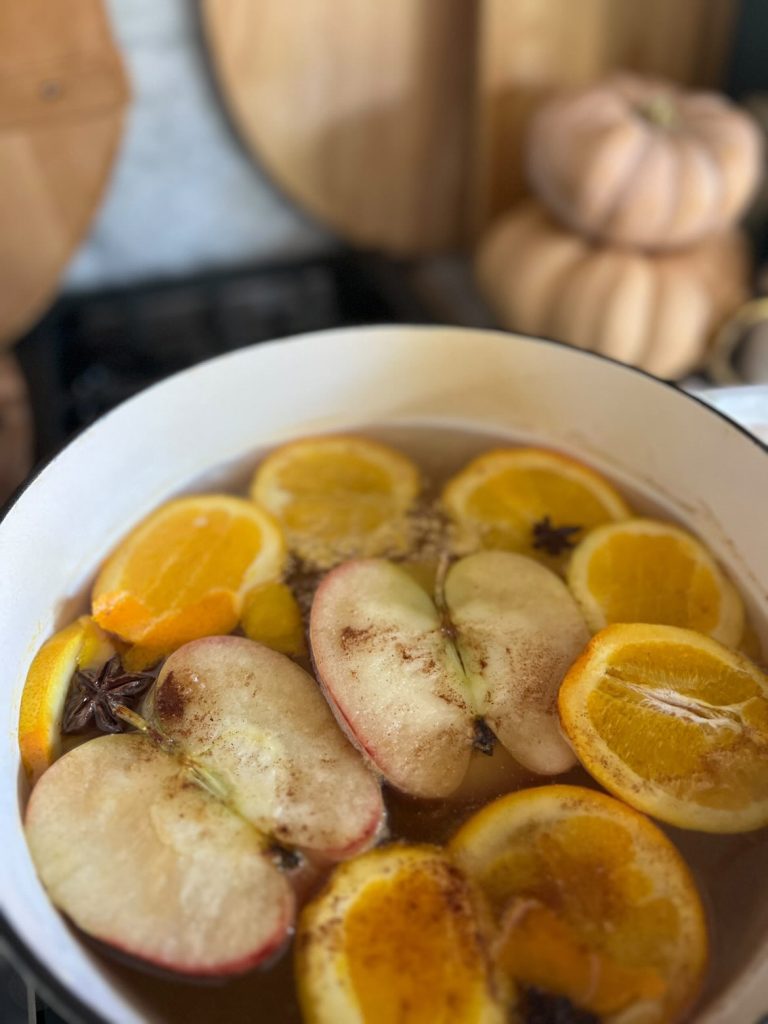 Fall simmer pot recipe with apples, oranges, and spices.