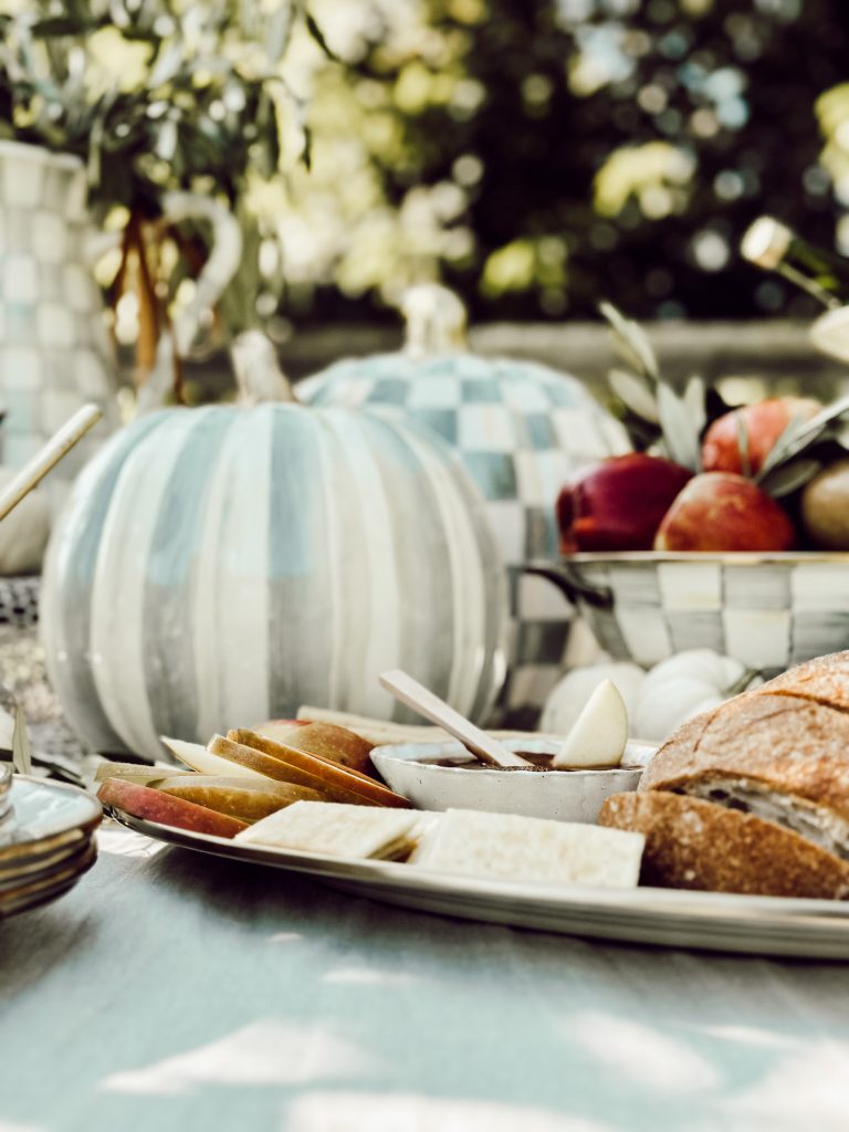 Fall tablescape with pumpkins and seasonal elements. 