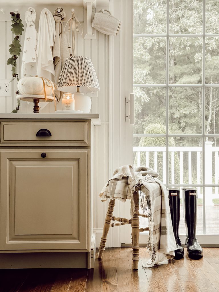 Farmhouse kitchen in autumn with DIY decor and natural elements.