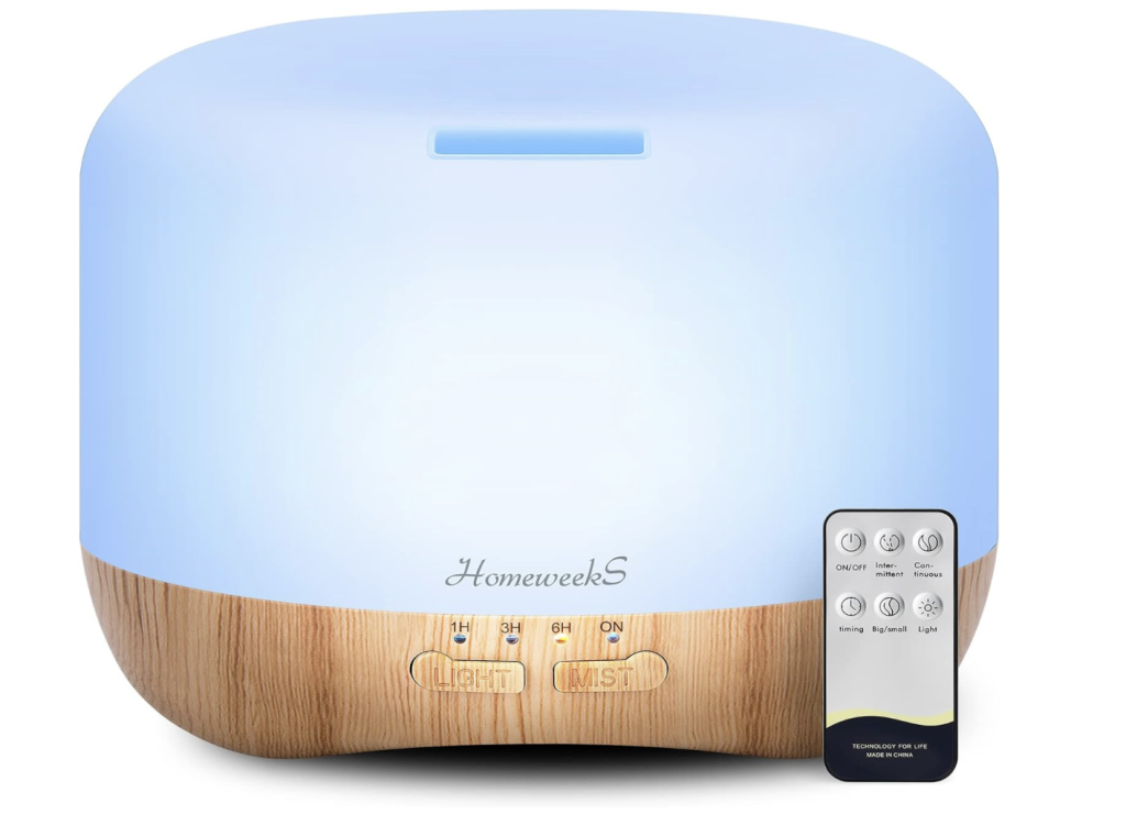 Essential oil diffuser with remote control and changing lights.