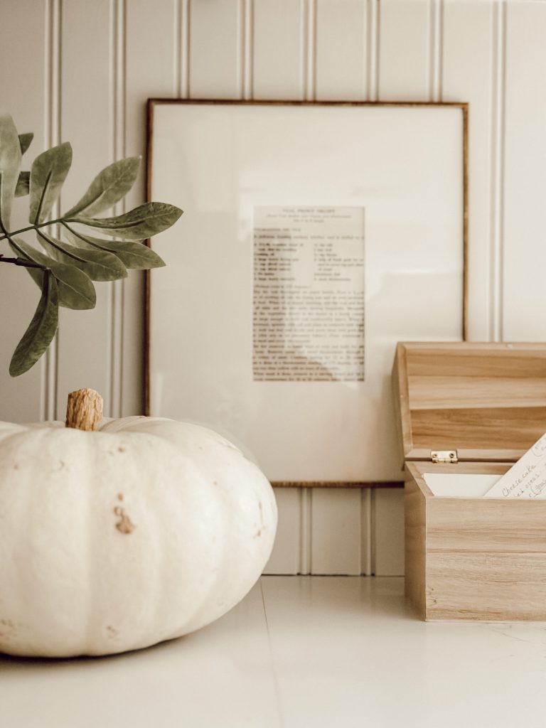 Personalized decor in the kitchen with family recipes displayed on the wall.