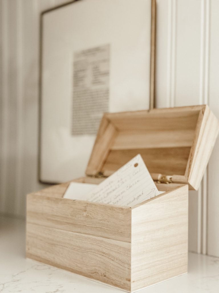 Recipe box with family recipes on a kitchen counter for functional decor. 