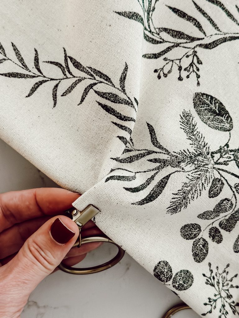 Attach clip ring to the DIY no sew window treatment for an updated look.