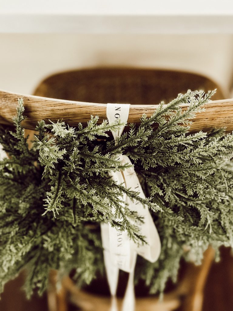Christmas kitchen decorations on chairs without floral wire or command hooks.