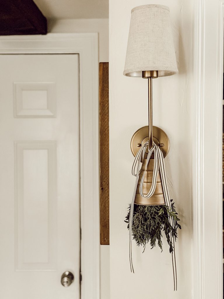 Holiday decoration in a beautiful home with bells and fresh greenery.