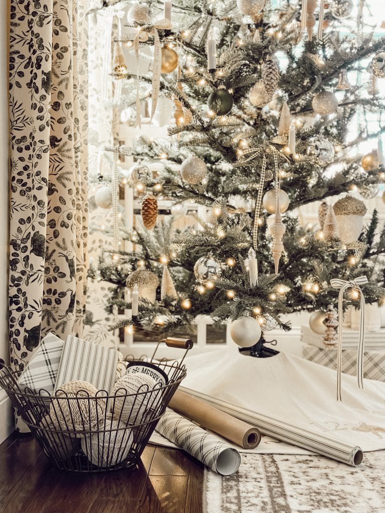 Neutral holiday decor ideas with a Christmas tree and wrapped Christmas gifts.