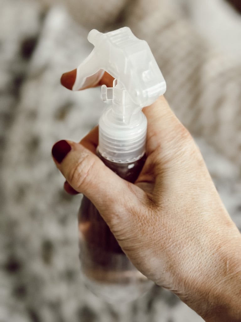 Spritz sheets and bedding with a lavender linen spray to create a cozy atmosphere.