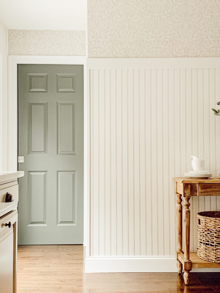 Charming floral pattern wallpaper in a cottagecore kitchen.