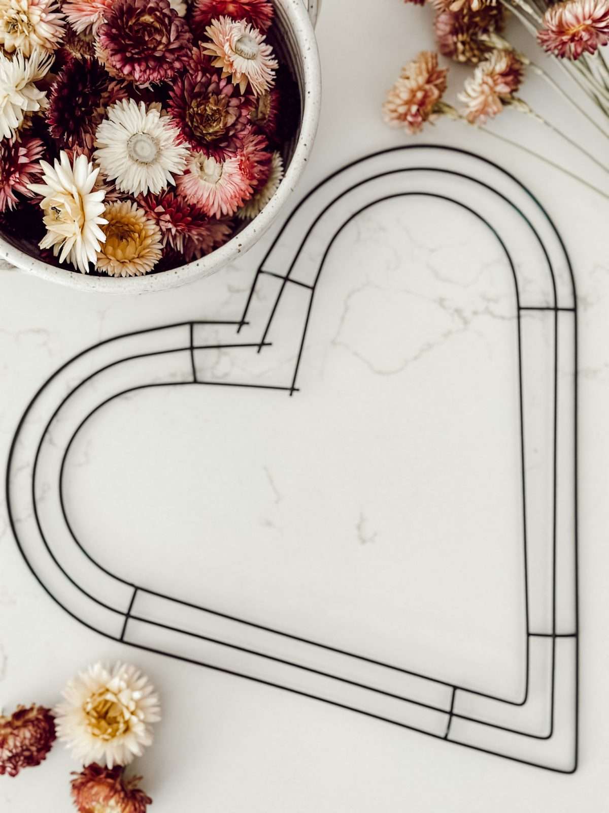 Supplies you'll need to make your own dried floral wreath at home.