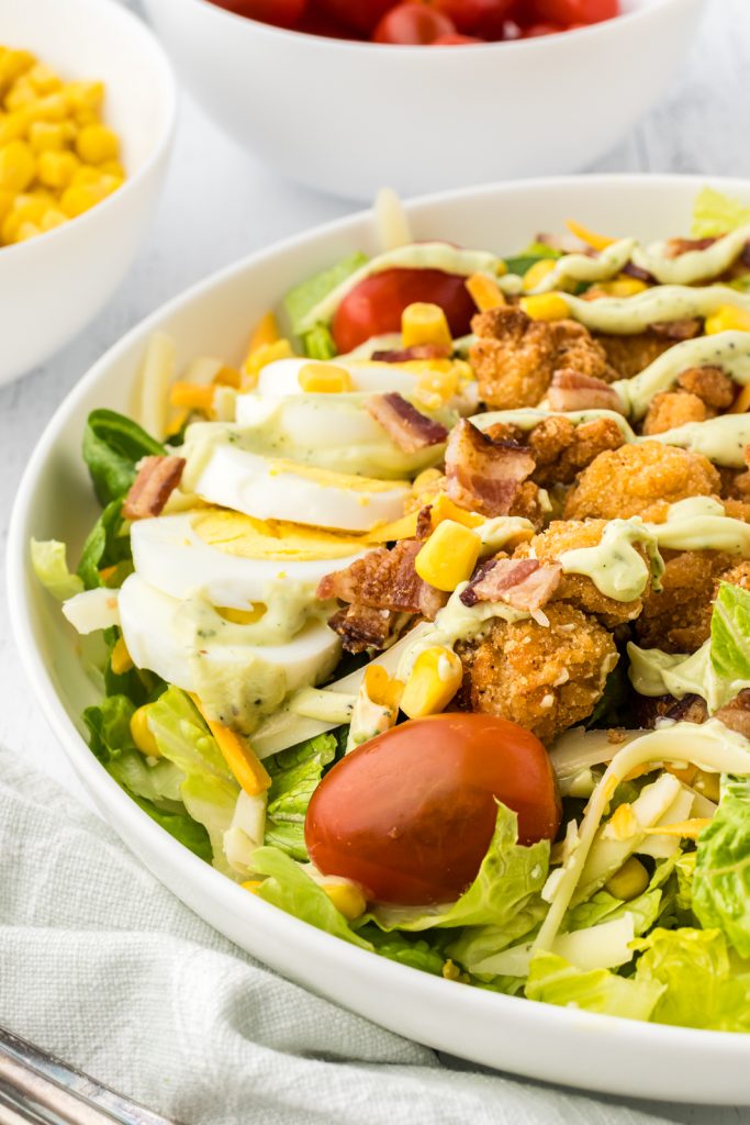 Chick fil a Cobb salad with crisp lettuce, tender chicken, and crispy bacon.
