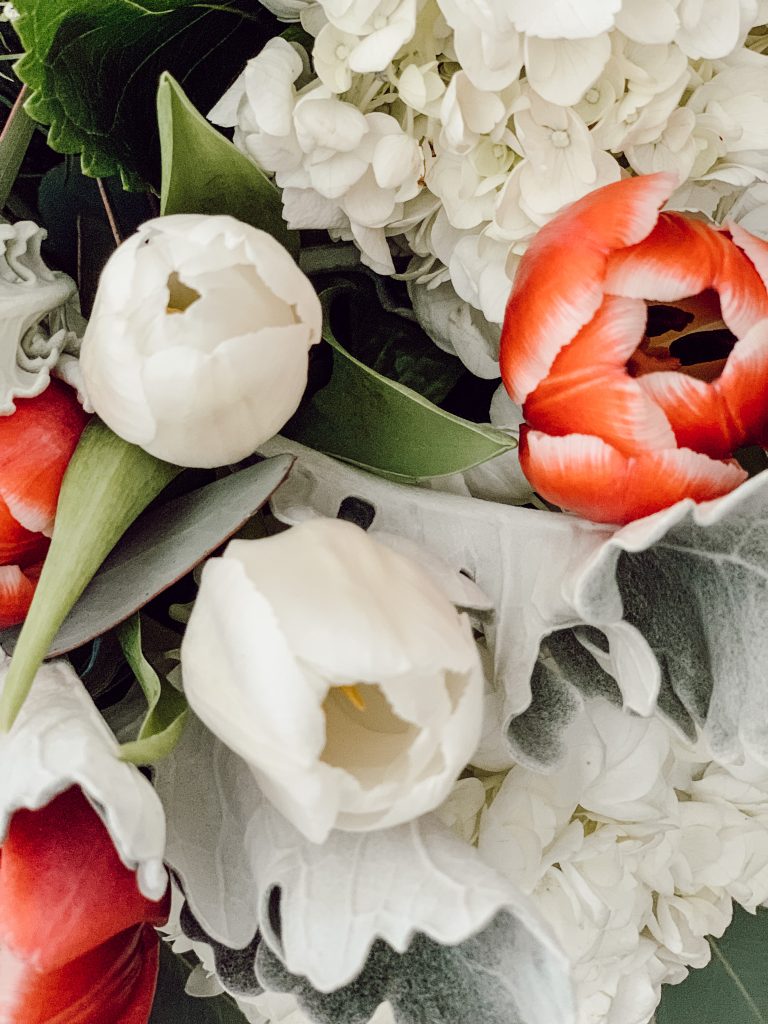 Pink tulips in an arrangement for Easter with other popular spring flowers.