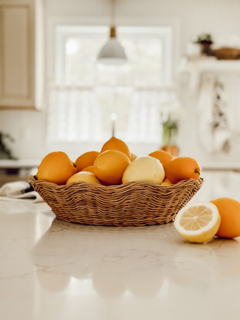 Basket full of special lemons like Meyer lemons and common lemons.