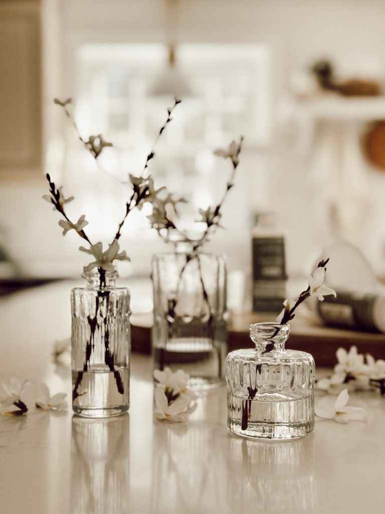 Create a DIY faux floral arrangement with acrylic water for home decor all year round.