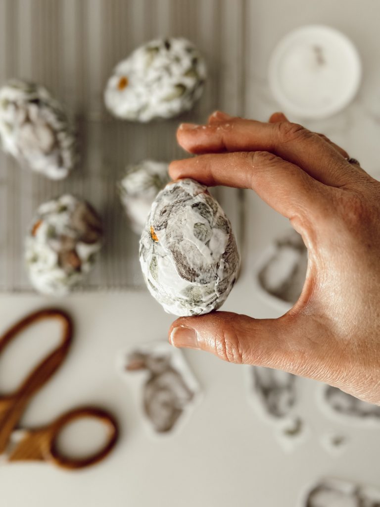 Mod Podge easter egg craft with foam eggs, paper napkins, and a decoupage medium.