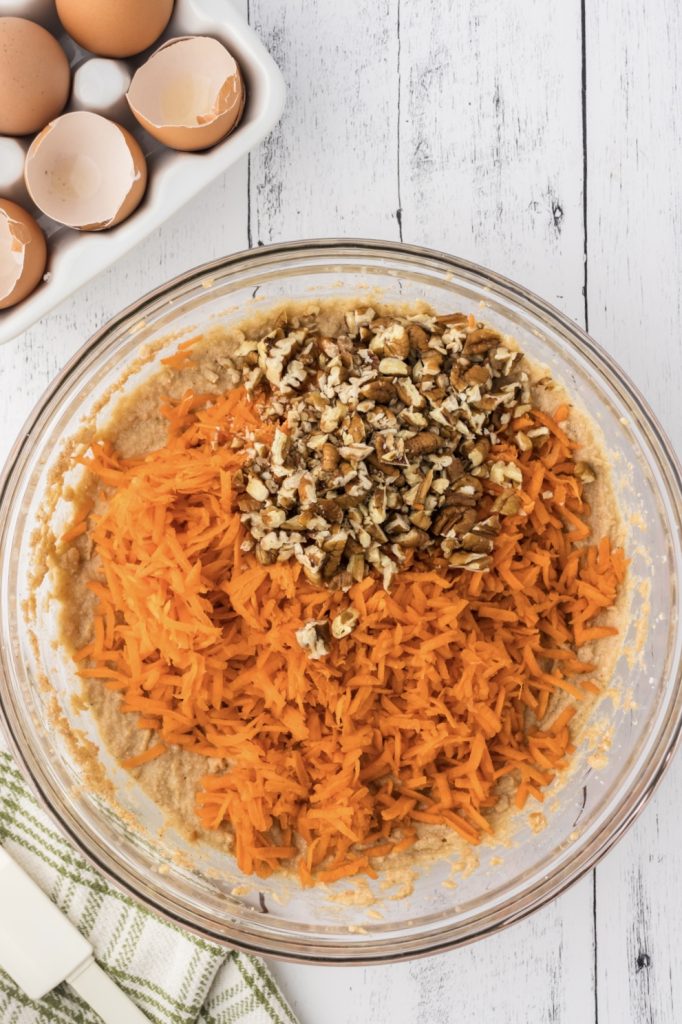 Shredded carrots and chopped pecans in the cake batter.