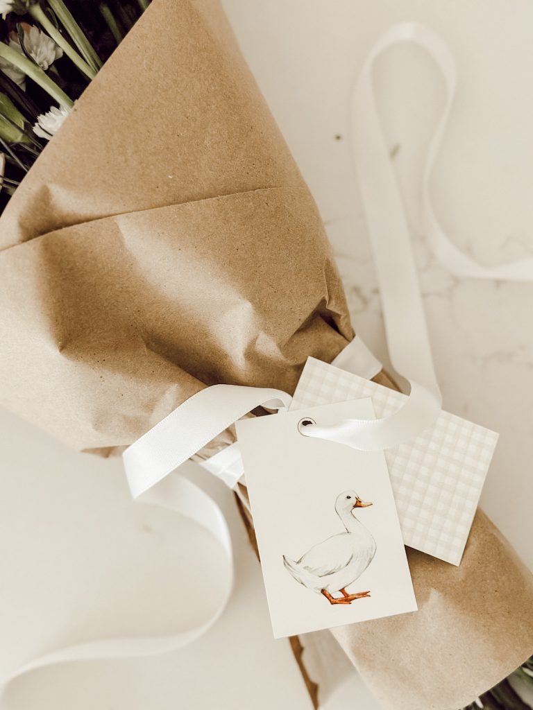 Homemade gift tags added to the flower arrangement for gift giving.