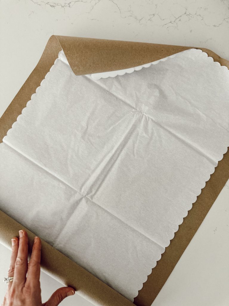 Kraft paper and tissue paper to wrap fresh flowers into a bouquet.