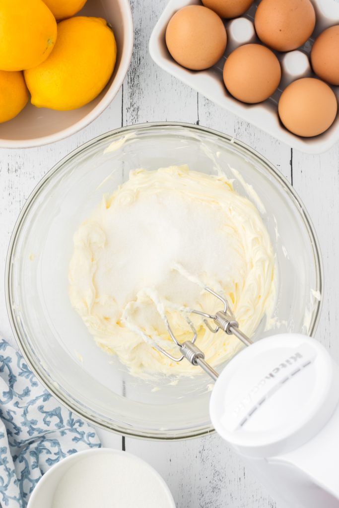 Beat butter and granulated sugar together for lemon pound cake recipe.