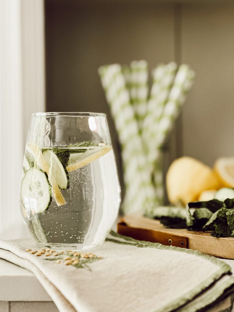 Fresh cucumber water with sliced cucumber, lemon slices, and fresh mint leaves.