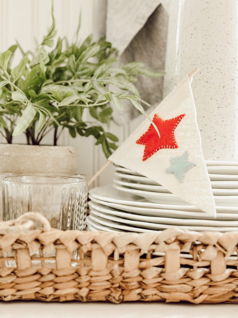 DIY 4th of July decorations with these mini flags in a kitchen vignette.