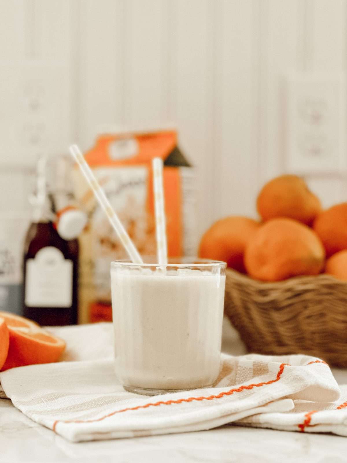 Banana orange smoothie recipe with greek yogurt, orange flavor, creamy bananas, and vanilla extract.