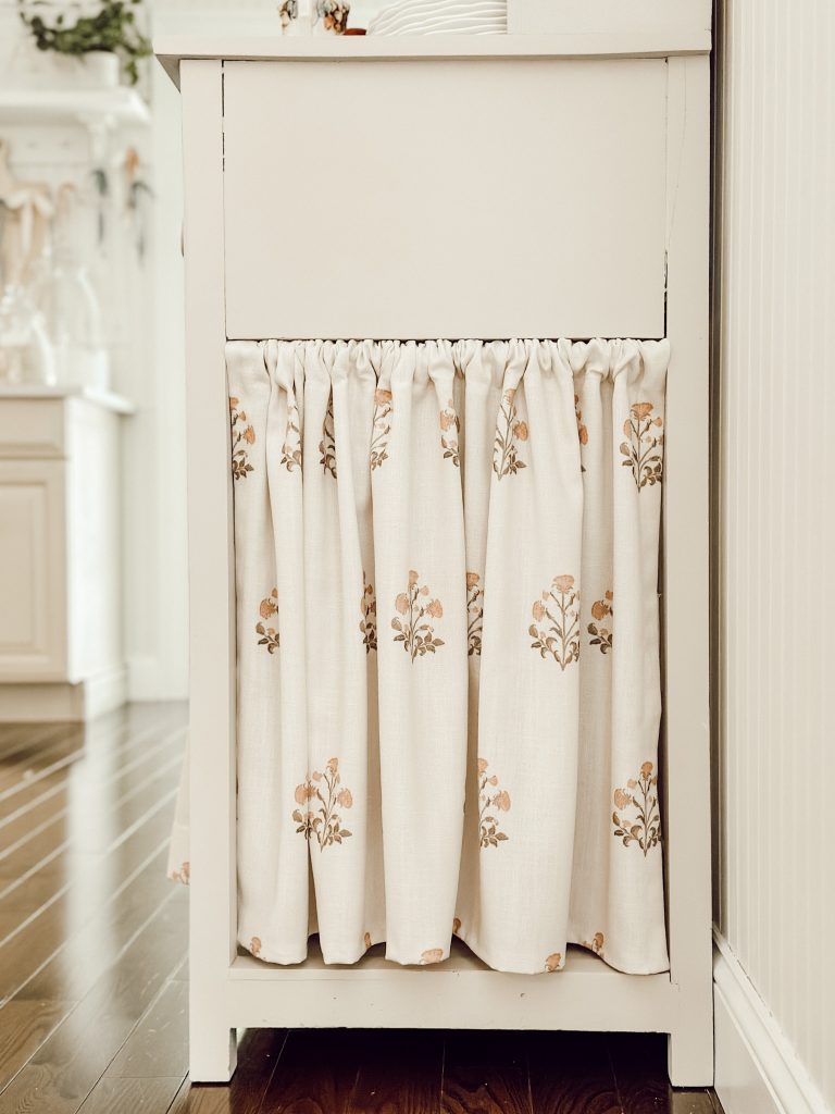 Block print apron made from linen fabric on kitchen hutch.