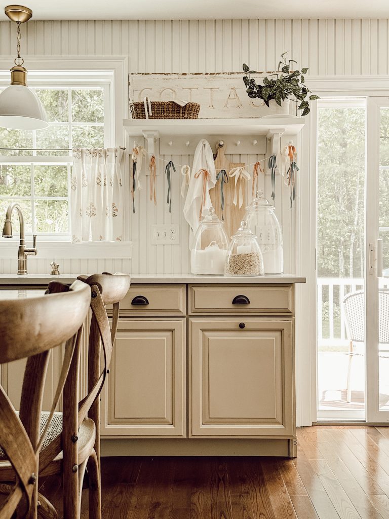 Block print decor with cafe curtains in the kitchen. 
