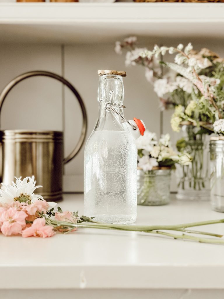Clay flower frog on a glass vessel to arrange wildflowers.