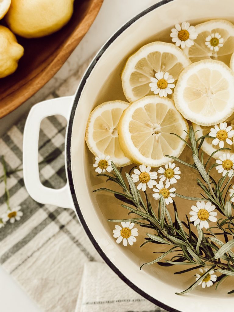 Fresh yellow lemons sliced with rosemary & chamomile to make a summer simmer pot. 