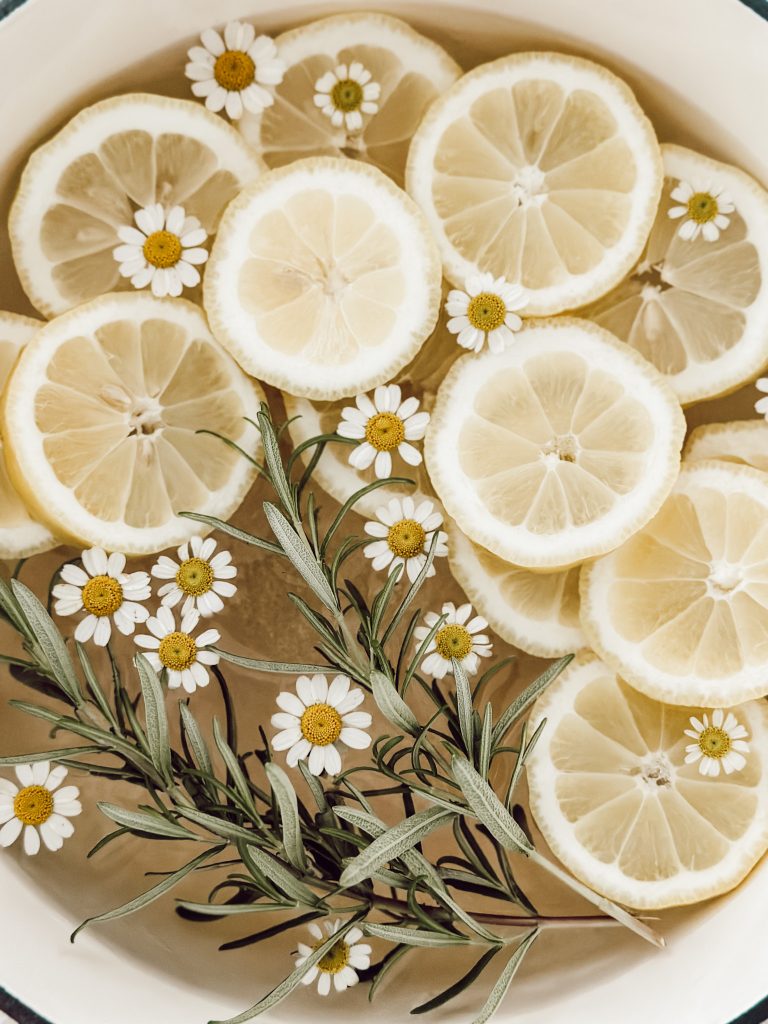 Lemon themed kitchen decorations with this homemade simmer pot with fresh lemons.