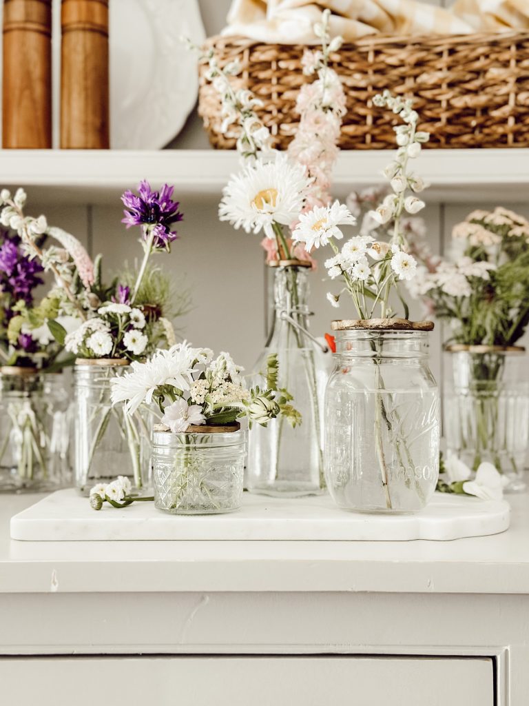 Mason jars filled with fresh flowers for easy home decor.